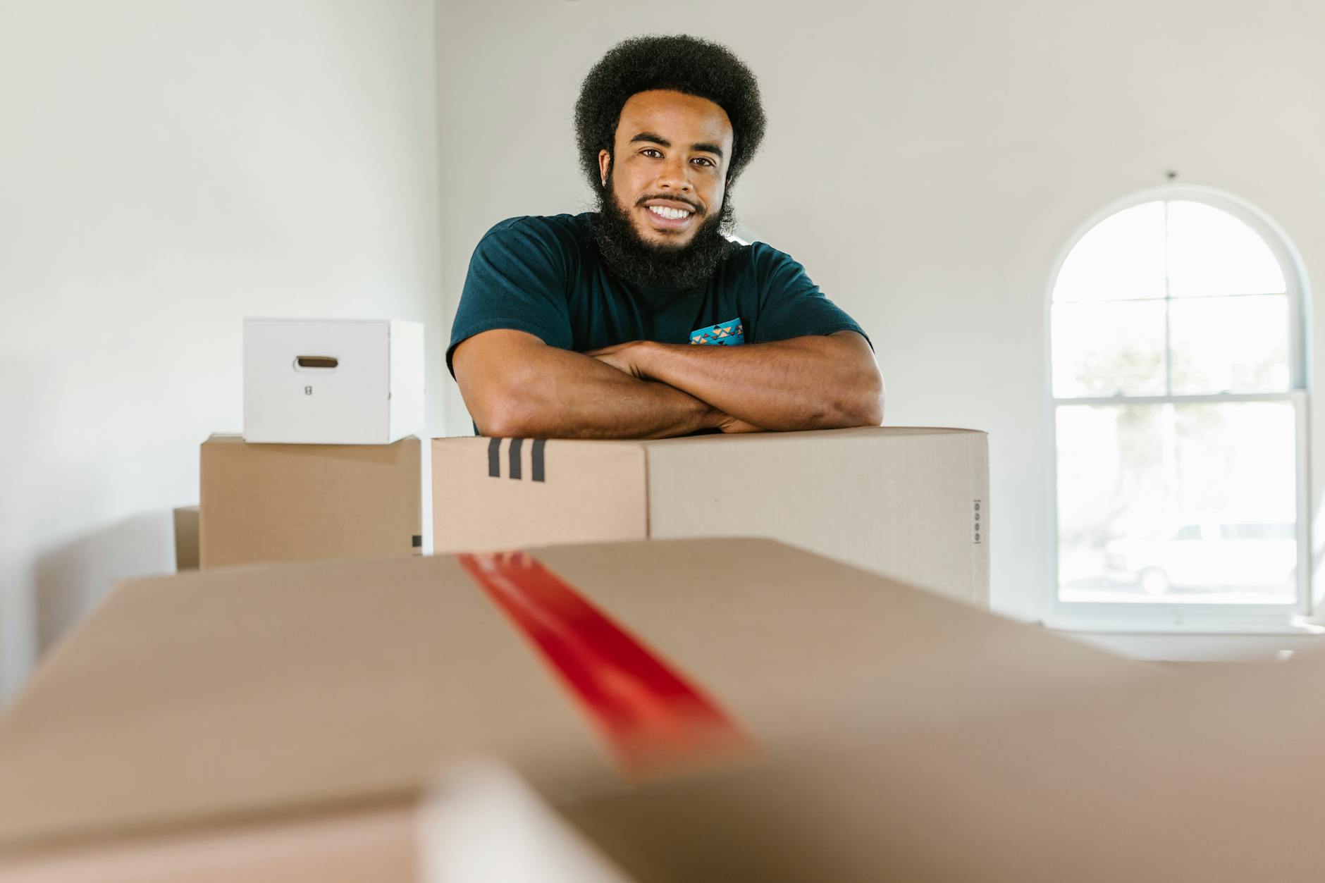 Professional movers carefully loading furniture onto a truck in South Carolina.